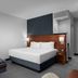 Courtyard by Marriott Pittsburgh Airport Settlers Ridge guest room with king bed and sofa in Pittsburgh