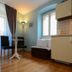 Villa Olivia in Split: bright room with chairs, table, sofa bed, windows and kitchenette