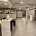 Quality Inn Nanaimo lobby with reception desk, elevator, and staircase in a modern interior