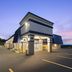 Days Inn by Wyndham Harrisonburg exterior at dusk with illuminated sign and empty parking lot