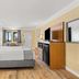 Travelodge by Wyndham San Clemente Beach guest room with king bed and ocean-view window