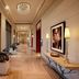 ITC Gardenia, a Luxury Collection Hotel, Bengaluru hallway with floor-to-ceiling windows and lit pool view