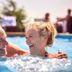 Guests laughing in the pool at The Beach Club on Madison Avenue, Cape May