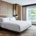 Chicago Marriott Southwest at Burr Ridge guest room with king bed and large window view in Burr Ridge