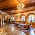 Moller Villa Hotel Shanghai lobby with ornate wood ceiling, chandeliers, arches and leather seating