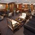 Meliá Paris Vendôme lounge in Paris with armchairs, sofas and a wood-paneled bar area