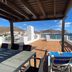 Aparthotel Vistamar in San José with a shaded terrace, loungers and sweeping ocean views