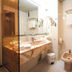 Hotel Plaça bathroom in Sant Feliu de Guíxols with sink, bidet, toilet and towel rack