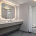 Homewood Suites by Hilton Fresno bathroom with vanity, mirror and shower-tub combo