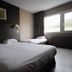 Hotel Val Vert in Pouilly-en-Auxois guest room with two twin beds and window view