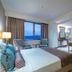 Royal Teos Thermal Resort Clinic & Spa room in Seferihisar with sea view, bed, TV and wardrobe