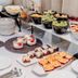 Savoy Boutique Hotel by TallinnHotels in Tallinn breakfast buffet with fruit, pastries, yogurt, and plates