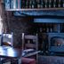 The Carpenters Arms, Bristol: cozy pub fireplace with wood-burning stove and rustic stone wall