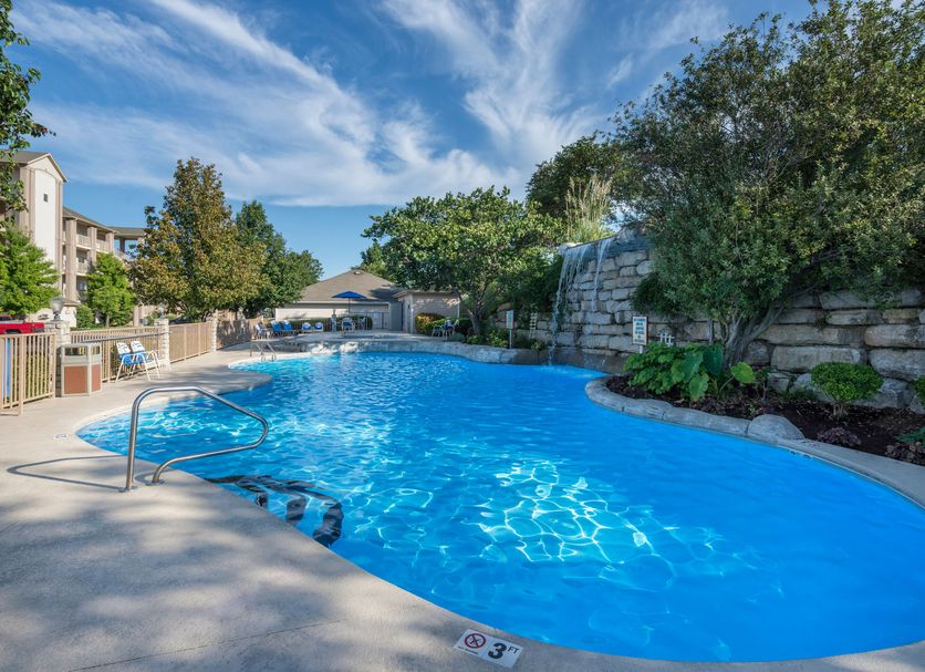 Westgate Branson Lakes Resort in Hollister with outdoor pool and rock waterfall landscape