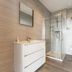 The Cottage In the Wood Malvern bathroom with shower, vanity, toilet and heated towel rail