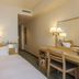 Shimonoseki Station West Washington Hotel Plaza room with single bed, desk, and mirror