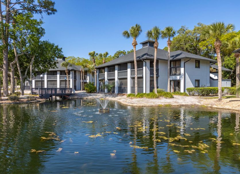 Legacy Vacation Resorts - Palm Coast hotel beside a lagoon with fountain and palm trees
