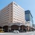 Richmond Hotel Kagoshima Kinseicho in Kagoshima, exterior corner view with arched ground-floor storefronts