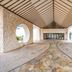 Oriental Hills Okinawa in Onna: stone-covered covered entryway with arched openings and mosaic floor