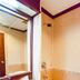 OYO 389 Sira Boutique Residence bathroom in Patong with sink, mirror, and bathtub