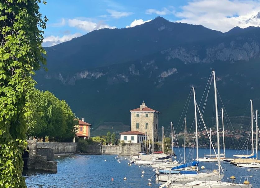 Miralago B&B and Apartments in Bellagio with lakeside marina, sailboats, and mountain backdrop