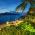 An Lam Retreats Ninh Van Bay in Thon Dam Van, beachfront bay view at dusk with lit garden terrace