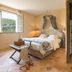 Hôtel-Spa Le Saint Cirq room in Bouzies with open window view and adjoining bathroom doorway
