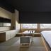 Onsen Ryokan Yuen Shinjuku Tokyo room with city view, low table, bench and bed