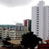 La Defense Apart Hotel in Montes Claros with city buildings and cloudy sky