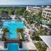 Paradisus La Perla – Adults Only in Playa del Carmen with a large pool, palm trees, and ocean view