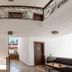 Panamare Apart Hotel Akyaka hallway with wrought-iron balcony railings and guest room doors