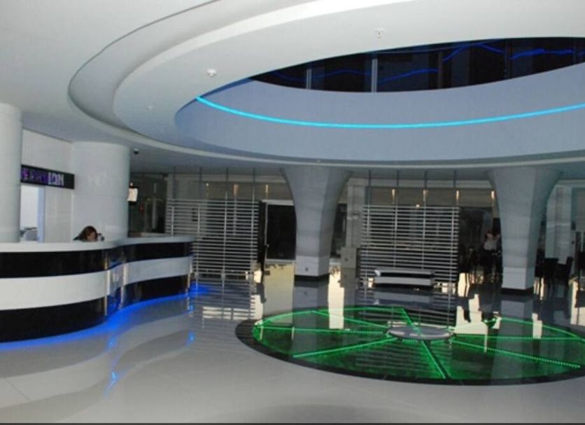 Golden Palas Hotel lobby in Çerkezköy with modern circular reception and blue accent lighting