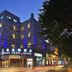 Shang Yuan Hotel Shang Xia Jiu Branch in Guangzhou exterior at dusk with lit facade and street view