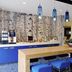 Novotel Rotterdam-Schiedam bar area with blue stools, pendant lights and buffet counter in Schiedam