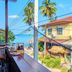 Aforetime Beach House in Ko Samui terrace dining with ocean view and palm trees