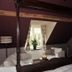 La Maison De Maitre in Arbrefontaine bedroom with four-poster bed, seating area, and window view