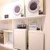 Lodge Koropokkuru in Niseko laundry room with stacked washers and dryers