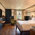 High Country Motor Lodge in Flagstaff: modern guest room with king bed, lounge chairs, and window view