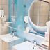 Home Inn Dalian Jinzhou Railway Station Stadium bathroom with walk-in shower and round mirror, Dalian