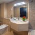 The Apartments, Dubai World Trade Centre bathroom with vanity, toilet, bathtub and mosaic-tiled walls in Dubai