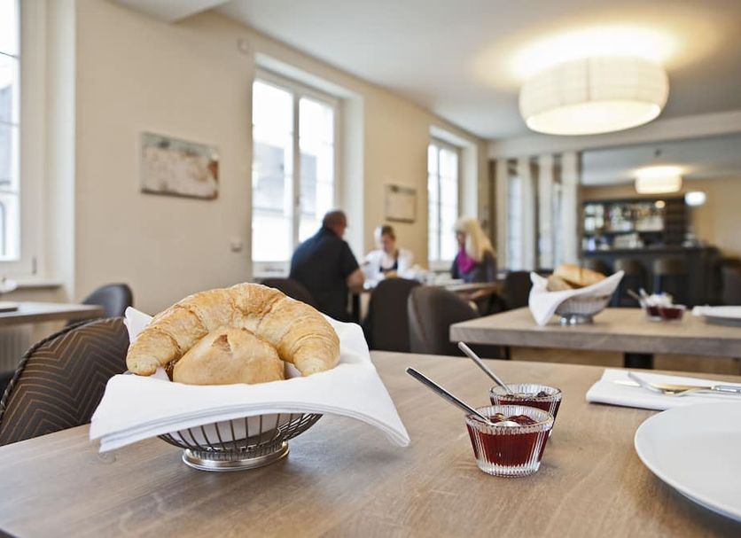 Breakfast table with croissants and jam at Kunsthotel 'Drei König' am Marktplatz Stadt Lörrach, Lörrach