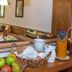 Bayerischer Hof in Münnerstadt breakfast buffet with fruit, pastries, juice dispenser and stacked plates