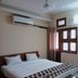 Goroomgo Mourya Inn Madhya Pradesh room in Harda with king bed, window, and air conditioner