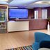 Fairfield Inn & Suites by Marriott Clarksville lobby with front desk, snack shelves and seating area