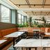 Leonardo Hotel San Sebastián in San Sebastian lobby with marble tables, black chairs and indoor plants