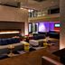 Aloft Seattle Redmond lobby with fireplace, colorful lounge seating, and modern open atrium in Redmond