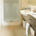 Bella Vista Motel Kaikoura bathroom with shower, sink, and wall-mounted hairdryer in Kaikoura