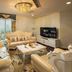 Super Candle Hotel Hanoi suite with ornate seating, chandelier, TV, and city view