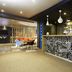 Ibis Valenciennes in Valenciennes hotel bar with modern seating and patterned front counter