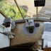 Viewtower Resort in Jeju City room with large corner window, bed, and small seating area